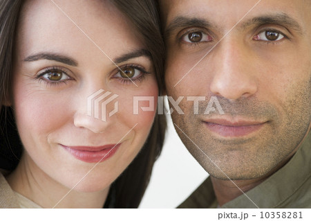 Studio portrait of couple smiling Studio portrait of couple smiling 10358281