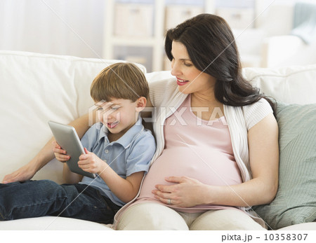 Mother and son (4-5) using tablet pc Mother and son (4-5) using tablet pc 10358307