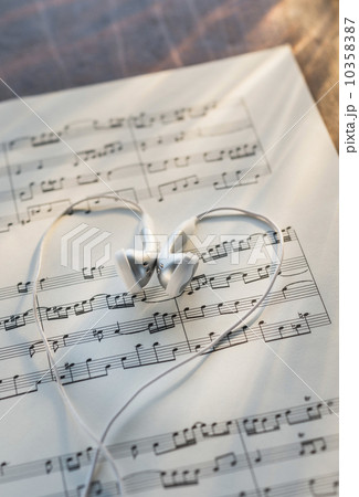 Studio shot of sheet music with earphones 10358387