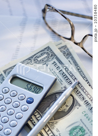 Calculator, pen and banknotes 10358480