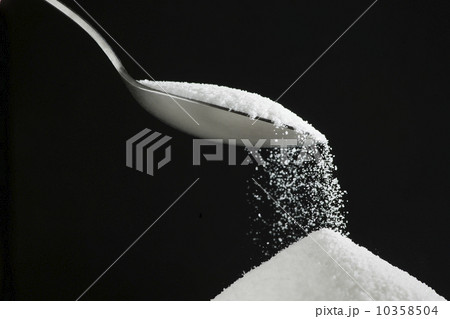 Spoon and heap of sugar 10358504