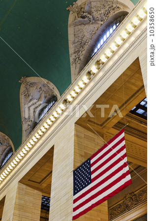 USA, New York State, New York City, Interior of Grand Central Station with American flag 10358650