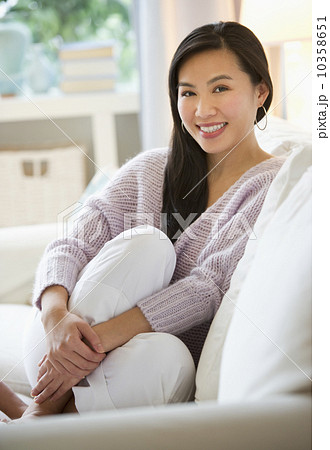 Woman relaxing on sofa Woman relaxing on sofa 10358651