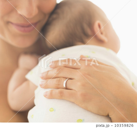 Mother hugging baby boy (2-5 months) Mother hugging baby boy (2-5 months) 10359826