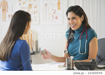 Doctor and patient (12-13) in doctor's office Doctor and patient (12-13) in doctor's office 10360049