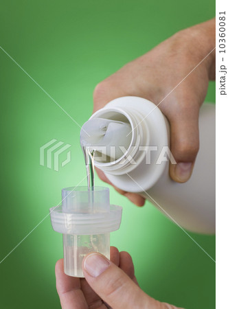 Hands pouring cleaning liquid Hands pouring cleaning liquid 10360081