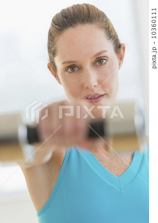 Woman exercising with weights 10360111