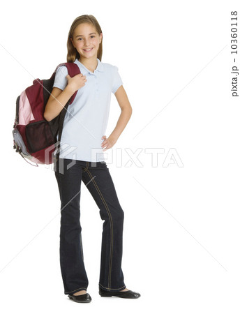 Portrait of schoolgirl (10-11) with backpack, studio shot 10360118