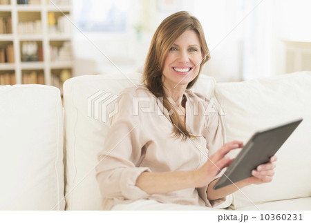 Portrait of woman using tablet pc 10360231
