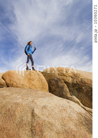 USA, California, Joshua Tree National Park, Female hiker on rocks USA, California, Joshua Tree National Park, Female hiker on rocks 10360271