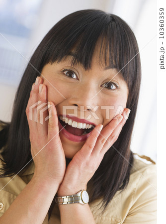 Excited mid adult woman Excited mid adult woman 10360359