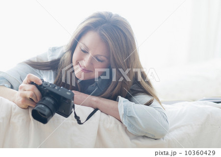 Portrait of woman photographing 10360429