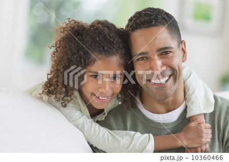 Portrait of smiling father and daughter (6-7)  10360466