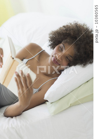 Woman reading in bed 10360565