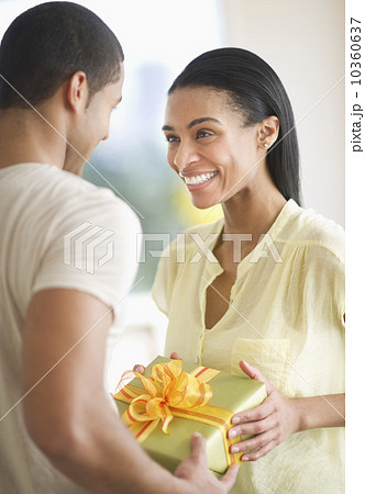 Couple holding gift box Couple holding gift box 10360637