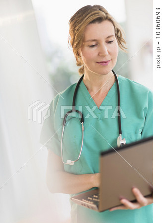 Female doctor using laptop 10360693
