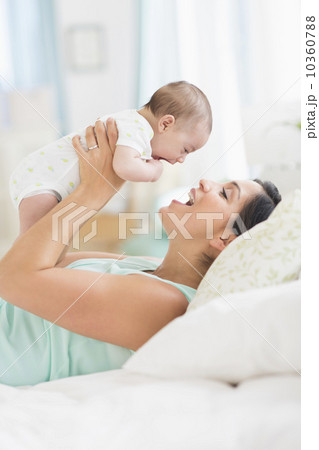 Mother playing with baby (2-5 months) Mother playing with baby (2-5 months) 10360788