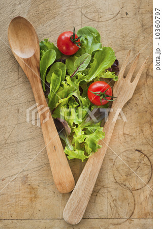 Salad leaves and wooden spoon and fork 10360797