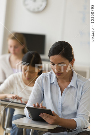 Students (14-19) using digital tablets 10360798