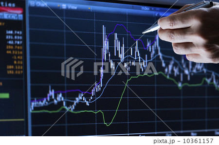 Hand pointing at financial graph, studio shot 10361157