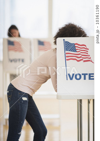 Woman in voting booth 10361190