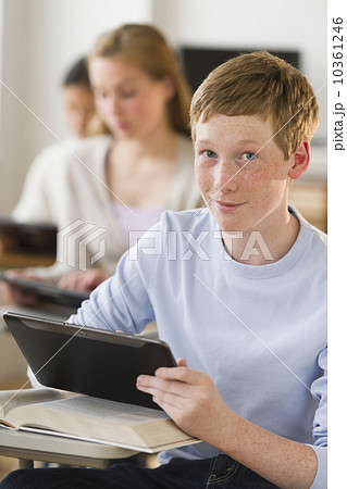 Students (14-17) using digital tablets at school 10361246