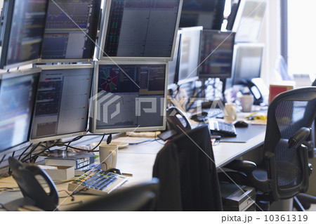Trading desk with computers and phones Trading desk with computers and phones 10361319