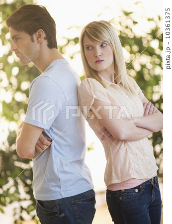 Angry couple standing back to back 10361375