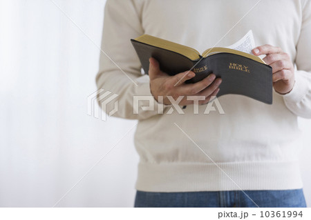 Man holding bible Man holding bible 10361994