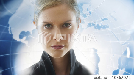 Portrait of businesswoman with world map in background 10362029