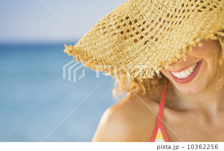 Close up of smiling woman in sun hat Close up of smiling woman in sun hat 10362256