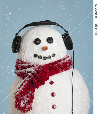Studio shot of snowman wearing headphones 10362279