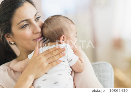 Mother embracing baby boy (2-5 months) Mother embracing baby boy (2-5 months) 10362430