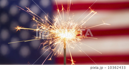 Sparkler and American flag Sparkler and American flag 10362433