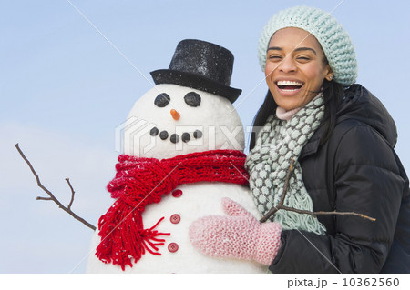 Portrait of woman with snowman 10362560