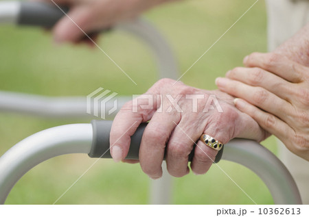 Senior walking with walker, close-up of hands 10362613
