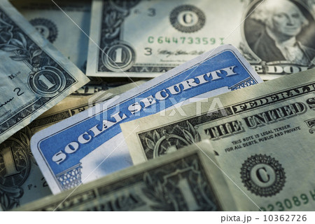 Studio shot of social security card and banknotes Studio shot of social security card and banknotes 10362726