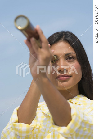 Woman looking through telescope Woman looking through telescope 10362797