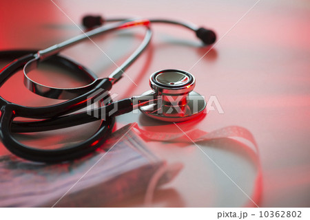 Close up of stethoscope and surgical mask, studio shot Close up of stethoscope and surgical mask, studio shot 10362802