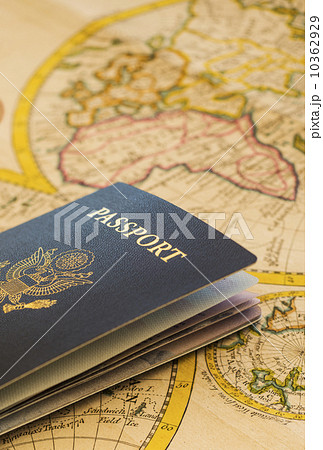 Passport sitting on antique map 10362929