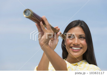 Woman looking through telescope Woman looking through telescope 10363117