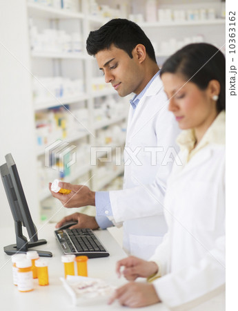 Two pharmacists in pharmacy Two pharmacists in pharmacy 10363162