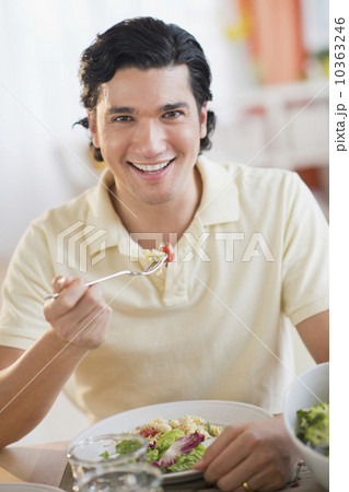 Portrait of man eating dinner 10363246