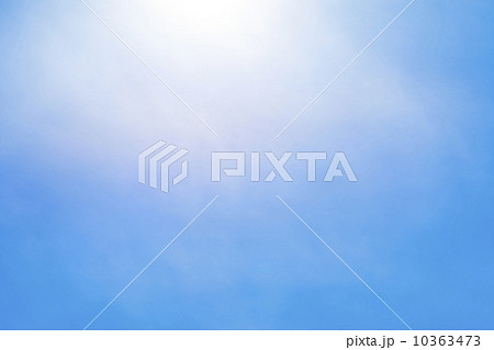 Sun behind small cloud on blue sky 10363473