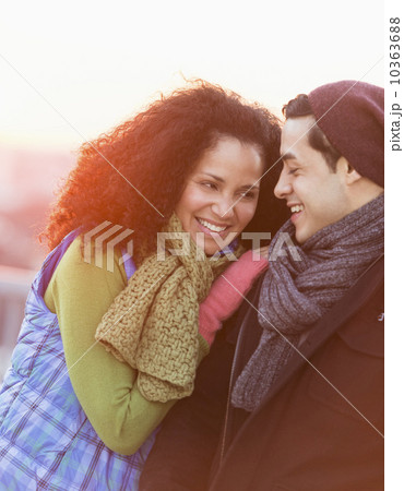 Portrait of happy couple embracing at sunset 10363688