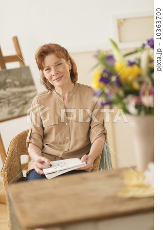 Portrait of female artist in studio 10363700