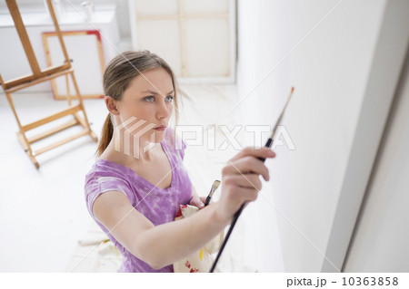 Female artist painting in studio 10363858