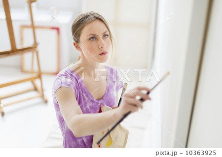 Female artist painting in studio 10363925