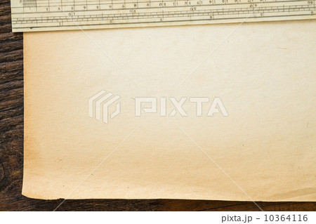 Old brown paper with ruler, studio shot Old brown paper with ruler, studio shot 10364116