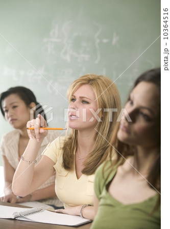 Young women in a college classroom Young women in a college classroom 10364516